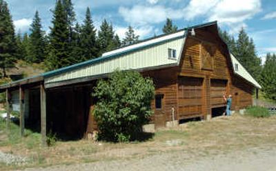 
Per Larsen closes the doors on the large barn at Cedar Springs Bed and Breakfast north of Rathdrum. The Larsens are asking for a permit to finish the inside of the barn for use as a wellness center.
 (Jesse Tinsley / The Spokesman-Review)