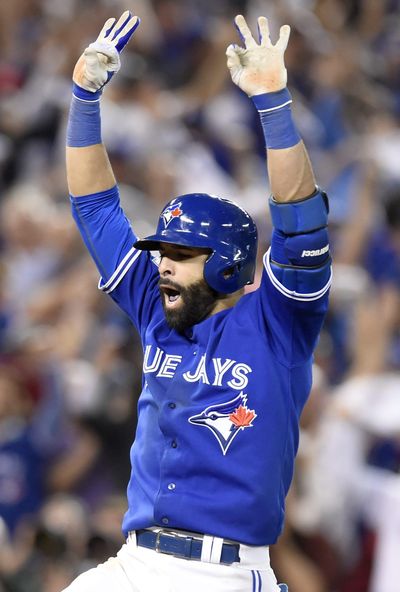 Toronto Blue Jays' Jose Bautista celebrates after hitting a three-run home run against the Texas Rangers during the seventh inning in Game 5 of baseball's American League Division Series on Wednesday in Toronto. (Frank Gunn / Associated Press)