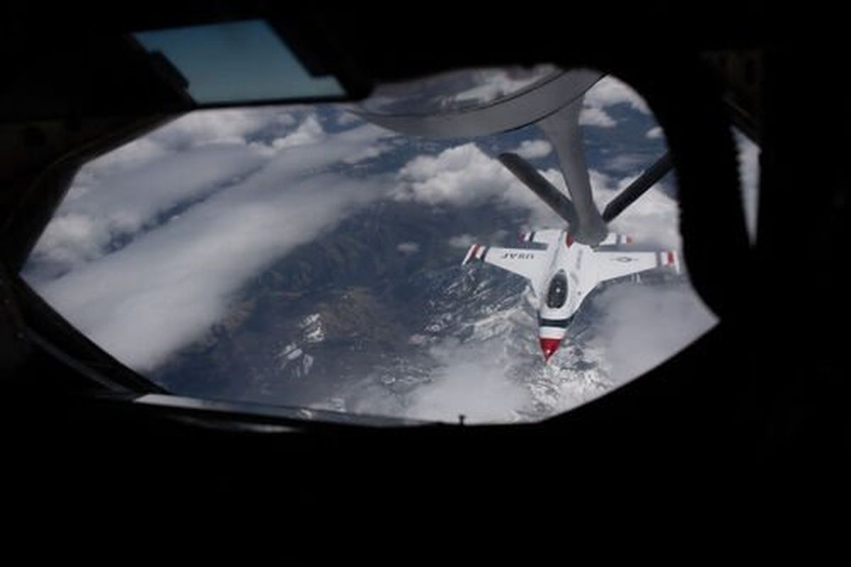 A member of the Air Force Thunderbirds flies under the refueling boom of a KC-135 Stratoganker on Thursday, May 12, 2022, as the Thunderbirds make their way to Fairchild Air Force Base for Skyfest this weekend in Airway Heights, Wash.  (Tyler Tjomsland/The Spokesman-Review)