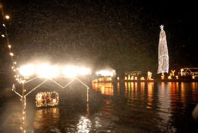 
Take a Fantasy Cruise on Lake Coeur d'Alene and you'll see Santa and Mrs. Claus wave from their boathouse diorama, while an artificial snowstorm is blown over visitors on cruise boats. 
 (File / The Spokesman-Review)