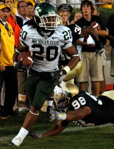 
Michigan State running back Jason Teague heads towards the end zone with the winning touchdown in overtime in a 44-41 victory. 
 (Associated Press / The Spokesman-Review)