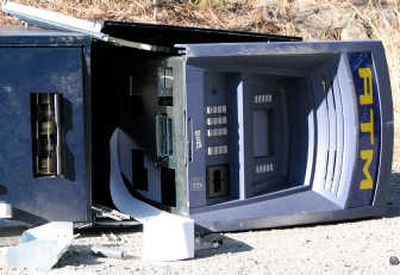 
A stolen ATM was abandoned on a rural road near Indian Canyon Golf Course after thieves used a stolen vehicle Wednesday morning to pull it from its base at a West Plains gas station. 
 (Amy Cannata / The Spokesman-Review)