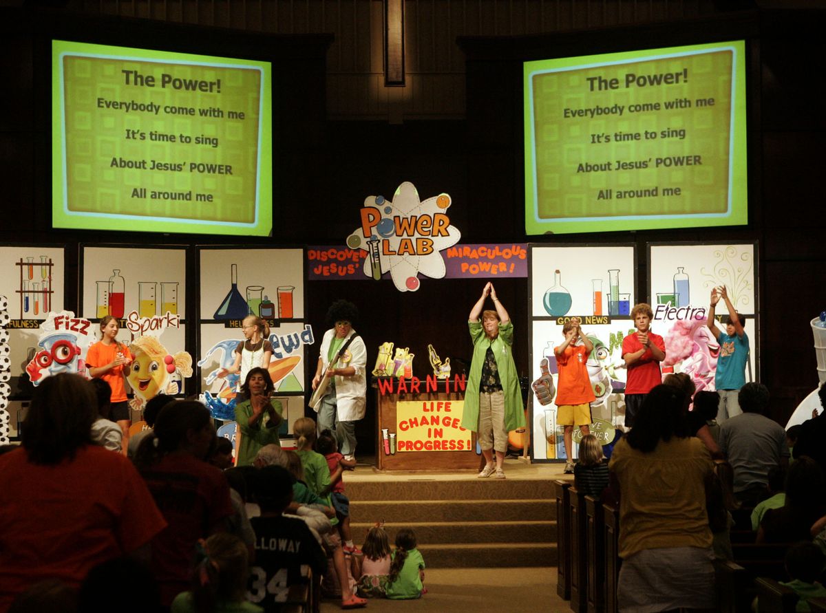 VBS staff lead in the theme song for the “Power Lab” during the vacation Bible school finale at the Mountain Brook Community Church in Birmingham, Ala. on  June 13. (Associated Press / The Spokesman-Review)