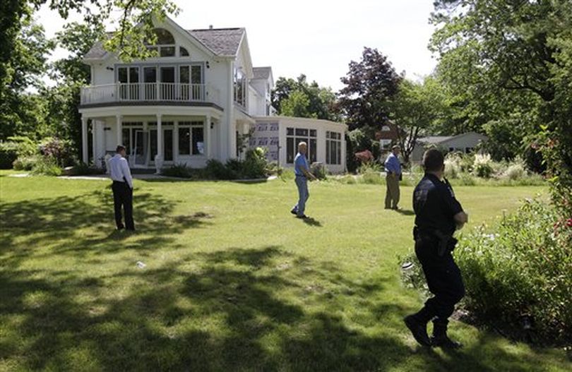 Law enforcement officers search the at home of Dr. Timothy Jorden in Hamburg, N.Y., Thursday, June 14, 2012. Jorden is sought in connection with the hospital shooting death of his ex-girlfriend at Erie County Medical Center in Buffalo, N.Y. on Wednesday. ( (AP Photo/David Duprey))