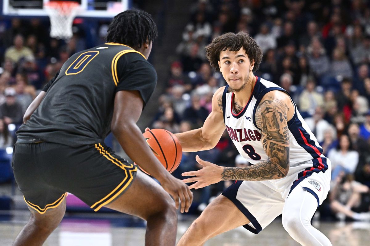 Gonzaga Bulldogs guard Jalen Warley (8) looks to pass the ball against Northwest Eagles forward Devin Wade-Henderson (0) in the first half of a NCAA exhibition basketball game on Sunday, Oct. 19, 2025, at the McCarthey Athletic Center in Spokane, WA. (James Snook/For The Spokesman-Review)