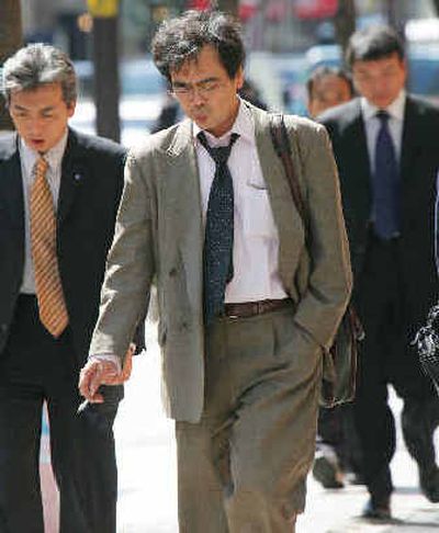 
Japan's bureaucratic rank-and-file march in jackets and ties to government offices every day, sweating their way through the country's sticky, sweltering summers. Starting today, they'll be sweating a little less. 
 (Associated Press / The Spokesman-Review)