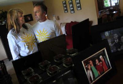 
Ron and Karen Haeger's home is filled with pictures of their family, including their son, Justin, right in foreground family photo, who died from an overdose of methadone in 2006. Last year, Ron started the Justin C. Haeger 10-miler. This year's run to raise awareness about prescription drug addiction will be Saturday.
 (Rajah Bose / The Spokesman-Review)