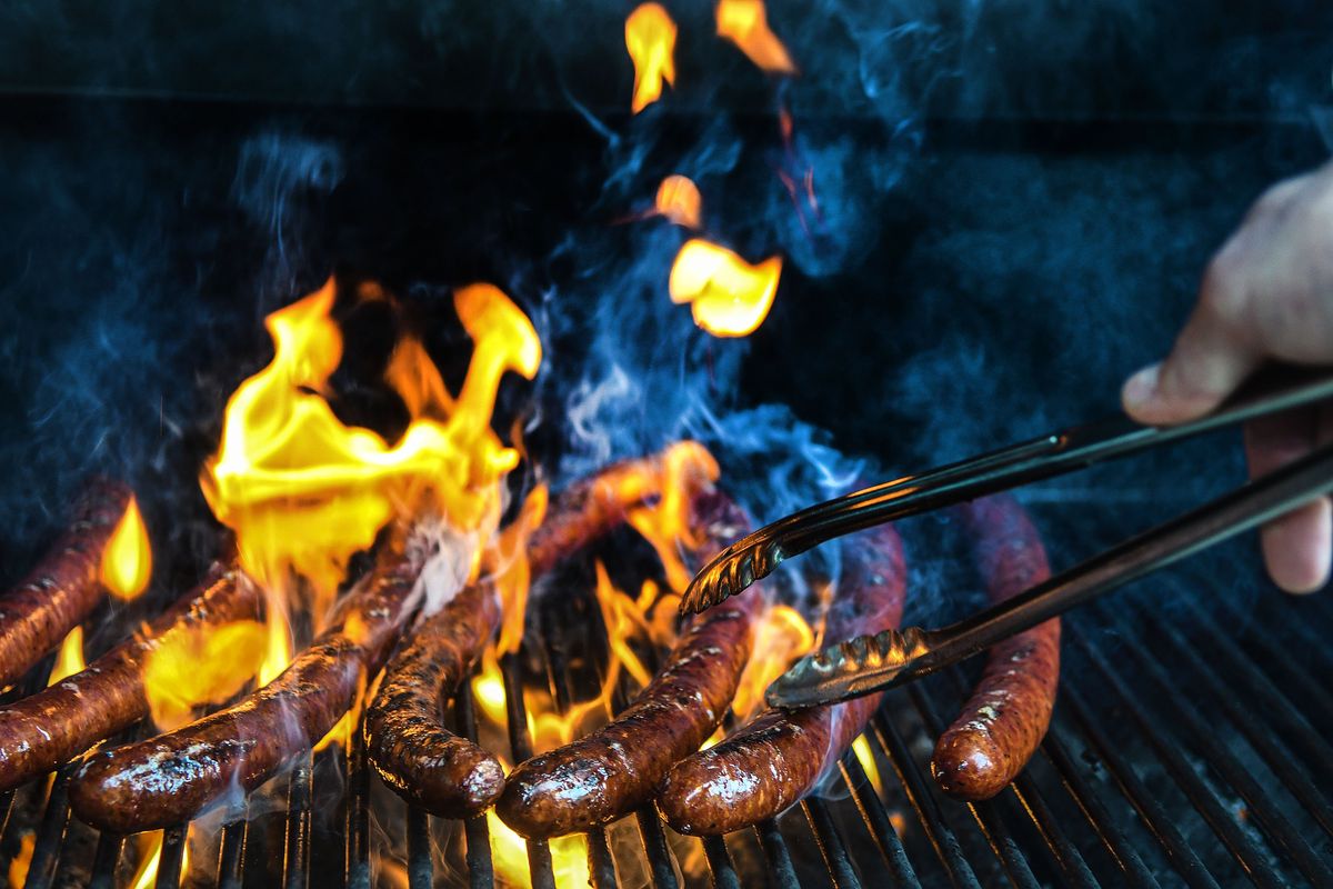 Sausage made from gene-edited pigs is grilled at Washington State University in Pullman on Wednesday.  (KATHY PLONKA/THE SPOKESMAN-REVIE)