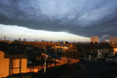 
A black cloud of smoke blankets northeast London on Sunday following an explosion at one of Britain's largest oil depots in Hemel Hempstead, hurling balls of fire skyward, shattering windows and blanketing nearby houses with smoke. 
 (Associated Press / The Spokesman-Review)