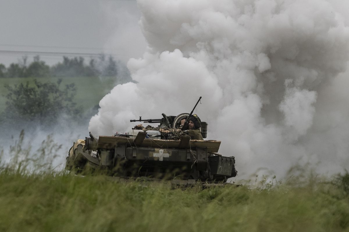 Ukrainian soldiers from the 1st Tank Brigade operate a Soviet-era T-64 during practice maneuvers in the Zaporizhzhia region May 24.    (Heidi Levine/For The Washington Post)
