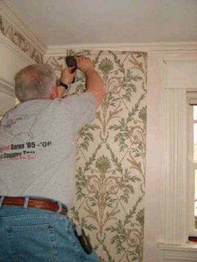 
Cutting wallpaper to fit around older woodwork is challenging, but can be done with patience and the right tools.
 (Kathy Carter / The Spokesman-Review)