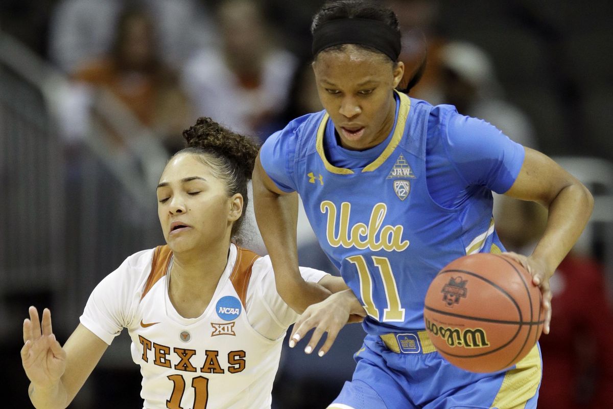 UCLA forward Lajahna Drummer, right, prevents a steal by Texas guard Brooke McCarty, left, during the first half of a women