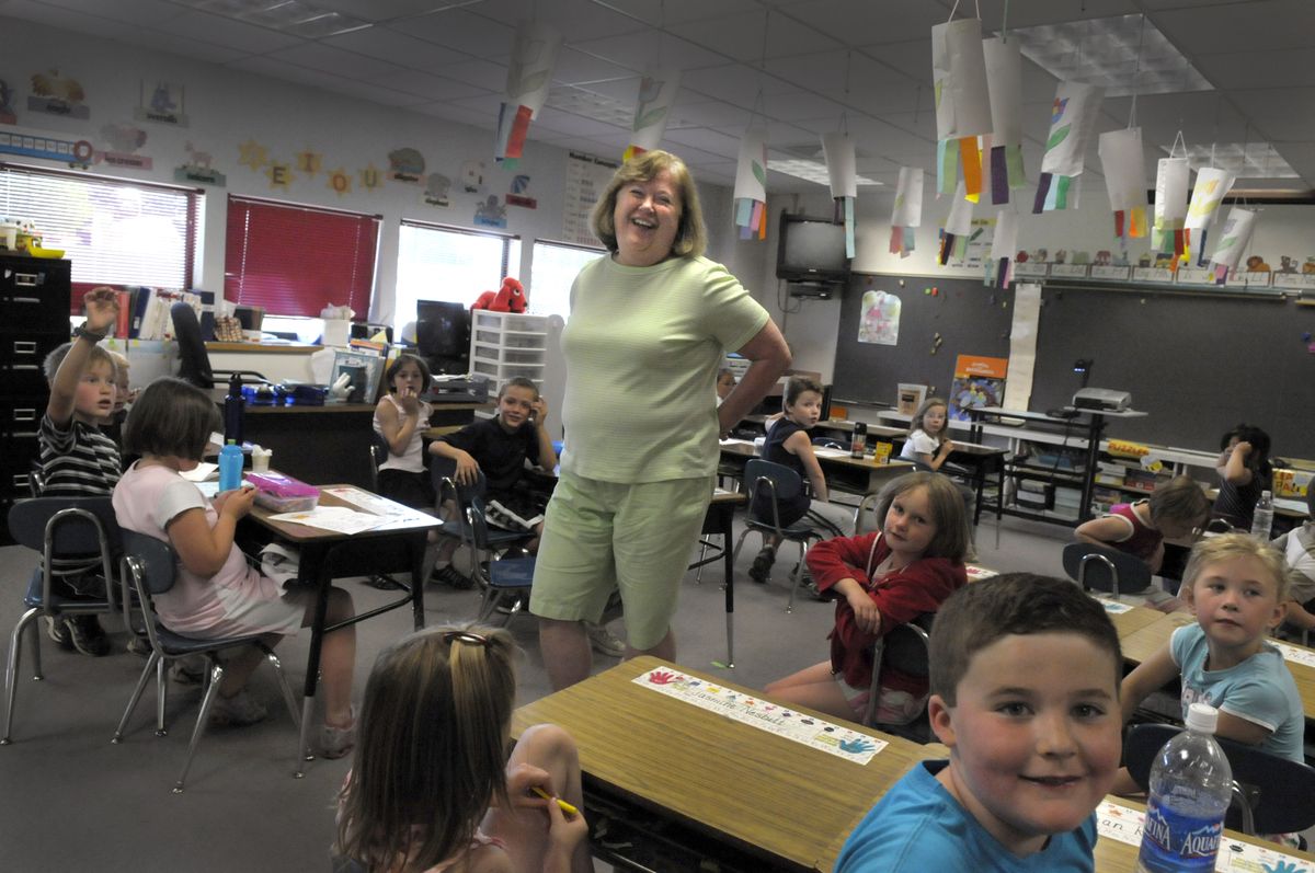 Mona Marlett is retiring after spending almost her entire teaching career in a first-grade classroom. She answers questions from her class after recess  June 12  at Trentwood Elementary. (CHRISTOPHER ANDERSON / The Spokesman-Review)