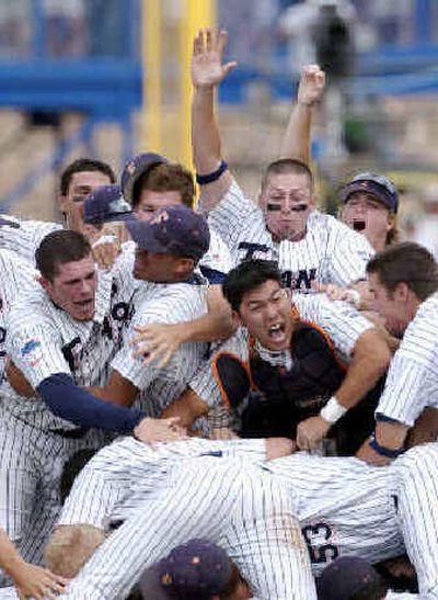 
Cal State Fullerton celebrates after beating Texas 3-2 on Sunday to win the College World Series in Omaha, Neb. 
 (Associated Press / The Spokesman-Review)