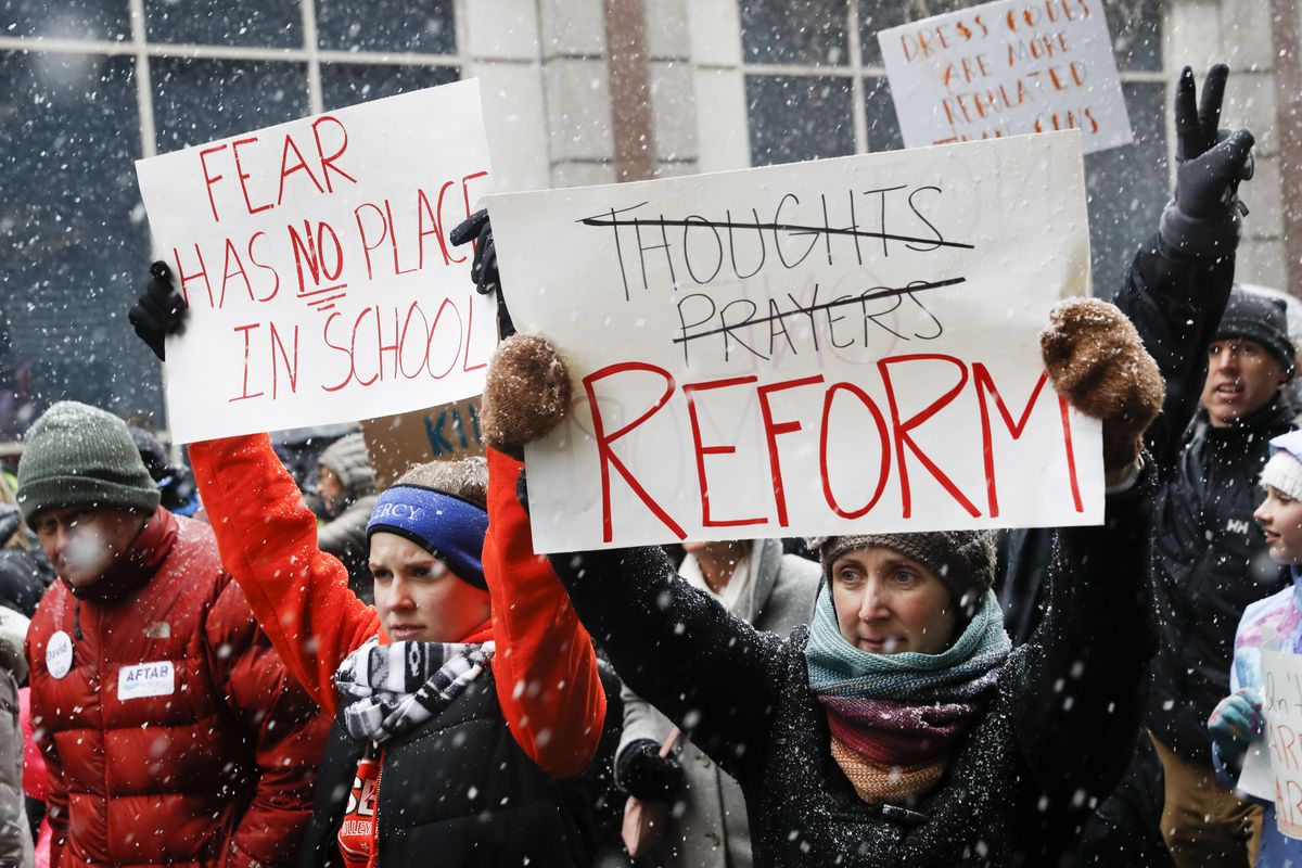 FILE - In this March 24, 2018, file photo, demonstrators march through downtown during the "March for Our Lives" protest for gun legislation and school safety in Cincinnati that was spearheaded by teens from Marjory Stoneman Douglas High School after the 2018 mass shooting in Parkland, Fla. President Biden faces an uphill battle as he tries to push for more state laws that would allow authorities to temporarily disarm people who are considered a danger to themselves or others. State lawmakers, governors of both parties and former President Donald Trump embraced the so-called red flag laws after the 2018 mass shooting in Florida.  (John Minchillo)