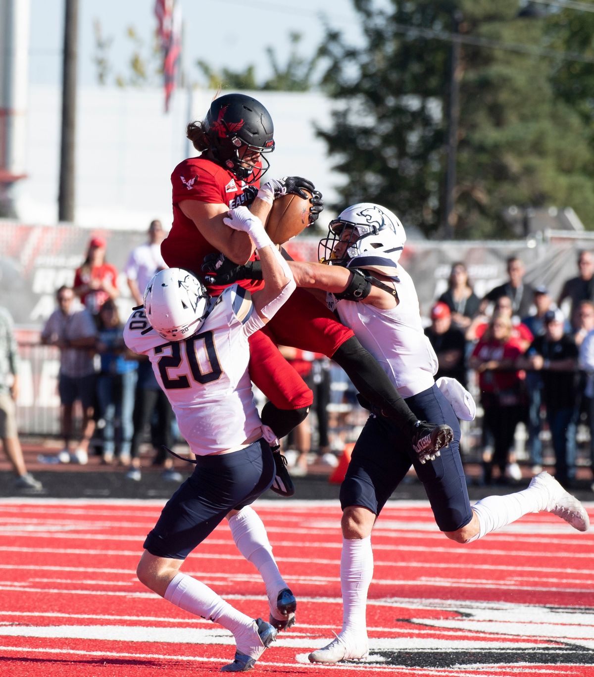 Late in the fourth quarter, down by less than a touchdown, the Eastern Eagles’ WR Miles Williams seeming makes a hero catch in heavy coverage, but as the scrum hits the ground, the ball pops loose and MSU’s Danny Uluilakepa (30) caught it before it hit the ground and was ruled an interception, ending the Eagle’s hopes for one more score to win the game Saturday, Sept. 24, 2022 at EWU in Cheney, Washington.  (Jesse Tinsley/THE SPOKESMAN-REVIEW)