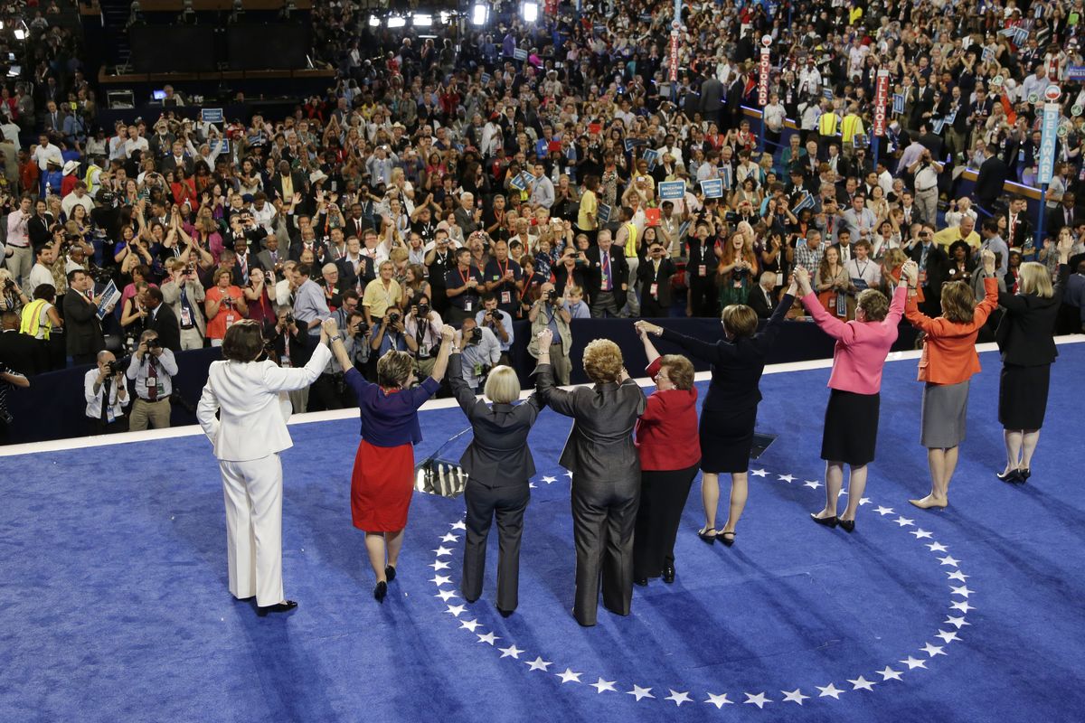 Women from the US Senate hold hands after Sen. Barbara Mikulski of Maryland
