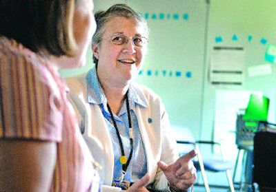 
Deb Van Slyke, the instructional coach for literacy at Chase Middle School, teaches Jodie Lang, a seventh-grade humanities teacher, on Tuesday. The Spokane Education Association recently convened a committee to look at what the district spends on instructional coaches and whether the teaching positions are effective. 
 (Jed Conklin / The Spokesman-Review)