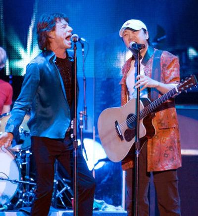 
Rolling Stones lead singer Mick Jagger, left, performs with Cui Jian, China's best-known rocker, in the 8,000-seat Shanghai Grand Stage in Shanghai, China, on Saturday. 
 (Associated Press / The Spokesman-Review)