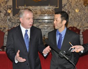 OLYMPIA -- Sen. Ed Murray, left, and his partner Michael Shiosaki, discuss the same-sex marriage bill Wednesday in the Legislative Building Reception Room before the bill is debated on the Senate floor. (Jim Camden)
