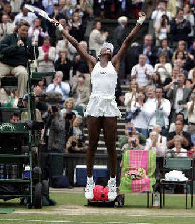 
Venus Williams jumps for joy after win.  
 (Associated Press / The Spokesman-Review)