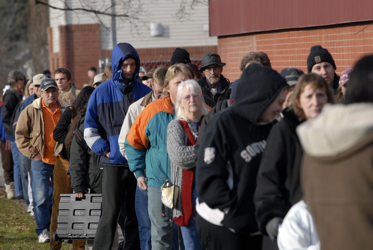The Spokesman-Review  People wait in line for a Thanksgiving meal package at Tuesday’s turkey distribution at the Salvation Army center on East Indiana Avenue. (Jesse Tinsley / The Spokesman-Review)