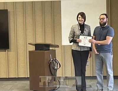 Rep. Cathy McMorris Rodgers presents a Library of Congress certificate to Jeremy Mullin of the Spokane Valley Library.  (Nina Culver)