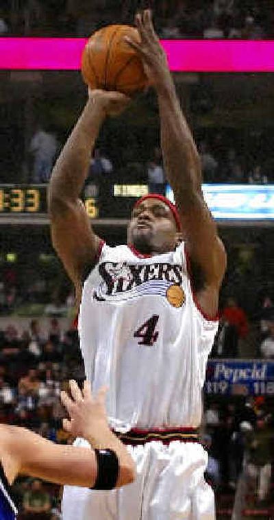 
At the expense of his former team, Sacramento, Chris Webber (4) scores his first points as a member of the Philadelphia 76ers. 
 (Associated Press / The Spokesman-Review)
