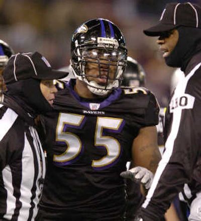 
Baltimore's Terrell Suggs talks with side judge Rick Patterson, left, and head linesman Phil McKinnely after New England scored the winning touchdown. Associated Press
 (Associated Press / The Spokesman-Review)
