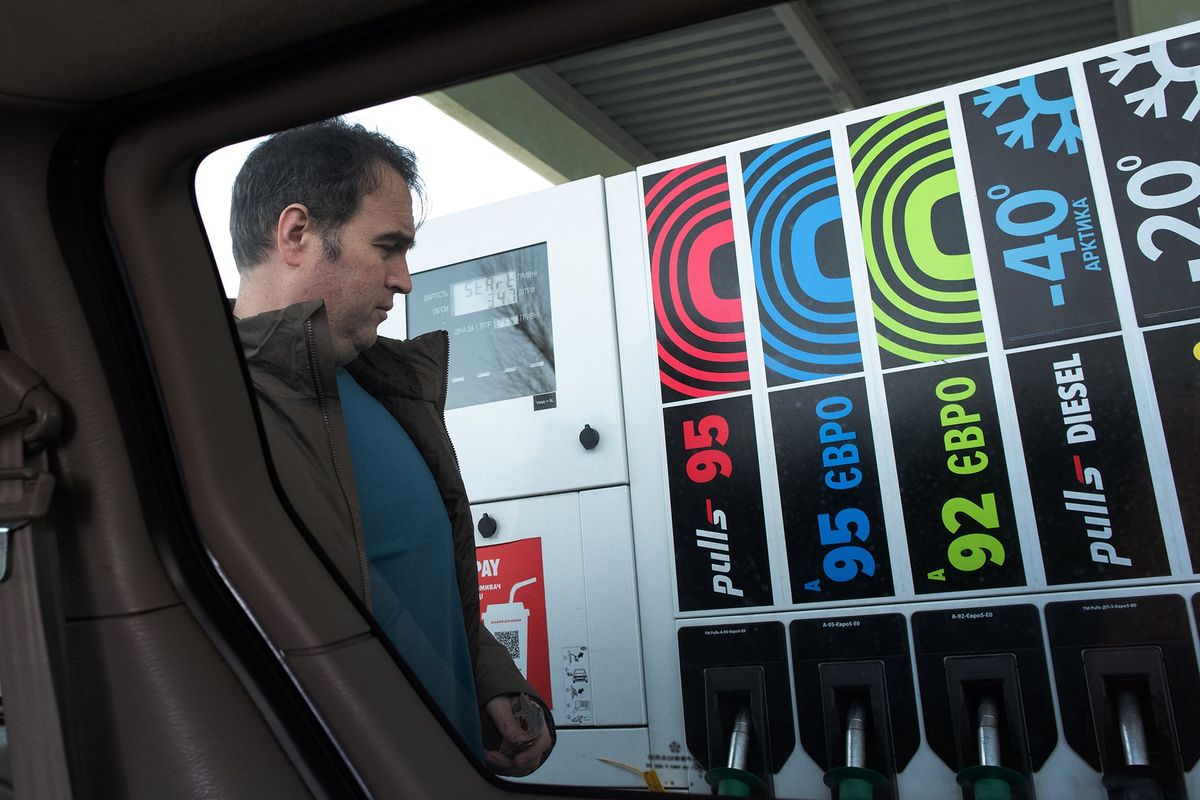 Kyle Varner buys gas on Wednesday in Lviv, Ukraine, before driving to the Polish border.  (Eli Francovich/The Spokesman-Review)
