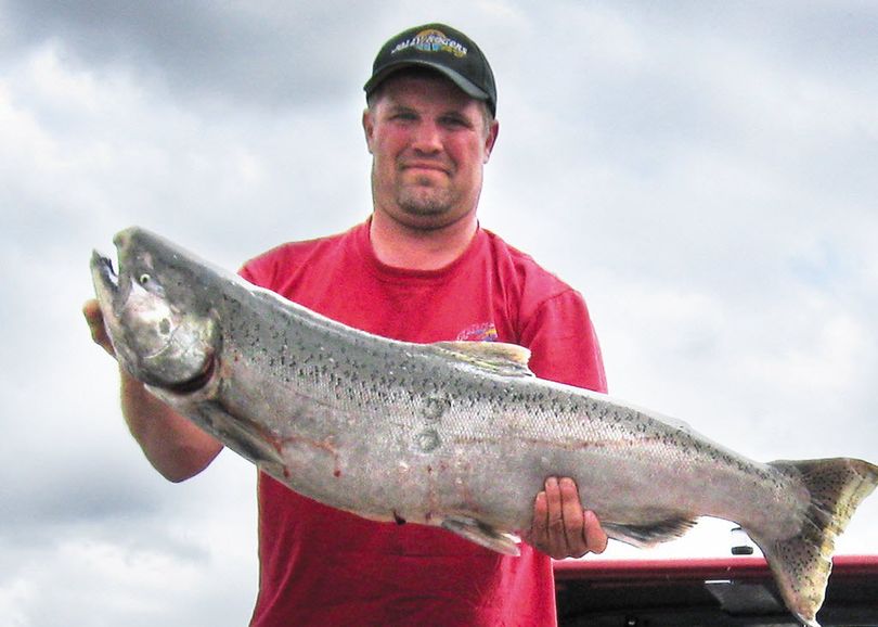 Lewiston angler Chuck Thompson holds the huge chinook salmon he hooked Sunday morning in the Clearwater River. It weighed in at almost 36 pounds more than four hours after being caught.  (Courtesy photo)