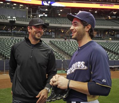 Ryan Braun’s past claims undermine credibility of supporters like Aaron Rodgers, left. (Associated Press)