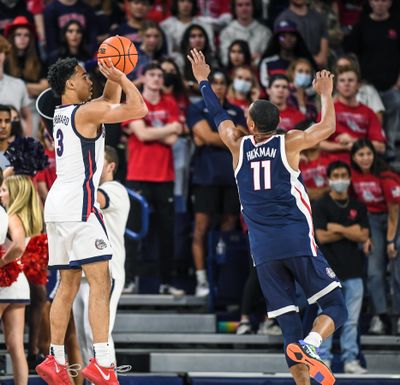 Gonzaga guard Andrew Nembhard launches a jumper over Nolan Hickman during a scrimmage at Kraziness in the Kennel.  (Dan Pelle/The Spokesman-Review)