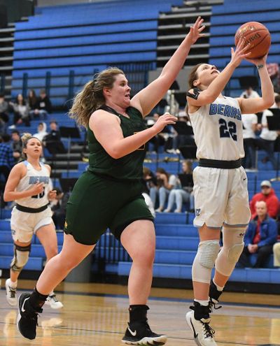 Central Valley's Grace Geldien (22) lays in the ball during the District 8 4A high school basketball playoffs on Wednesday, Feb. 12, 2020, at Central Valley High School in Spokane Valley, Wash. (Tyler Tjomsland / The Spokesman-Review)