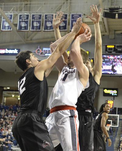 Gonzaga's Domantas Sabonis, right, struggles in the doubleteam of Loyola Marymount's Steve Haney, left, and Marin Mornar, right, Wednesday, Dec. 23, 2015 at McCarthey Athletic Center at Gonzaga University. Gonzaga cruised to 85-62 victory. (Jesse Tinsley / The Spokesman-Review)