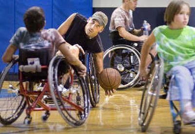 
Chad Farrington, center, grew to love the competitiveness of wheelchair rugby and now serves as a basketball coach. The Spokesman Review
 (Christopher Anderson The Spokesman Review / The Spokesman-Review)