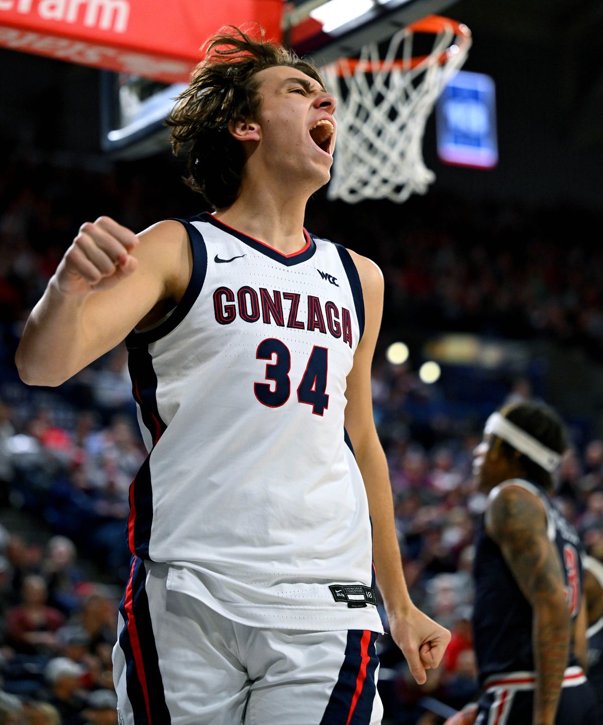 Gonzaga forward Braden Huff (34) celebrates after scoring 2 points on a dunk during the first half of a NCAA college basketball game with Jackson State, Wednesday, Dec. 20, 2023, in the McCarthey Athletic Center.  (COLIN MULVANY)