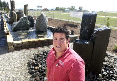 
Zack White is the manager of Tumble Stone, a decorative rock dealer which has opened a new display on Government Way to showcase its rock work. 
 (Jesse Tinsley / The Spokesman-Review)