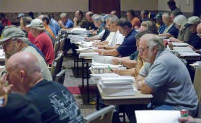 
United Auto Workers members meet at the Lansing Center in Lansing, Mich., in September to discuss the new contract with General Motors. The revolutionary new contract shifts $46.7 billion worth of retiree health care costs from the company to the union. Associated Press
 (Associated Press / The Spokesman-Review)