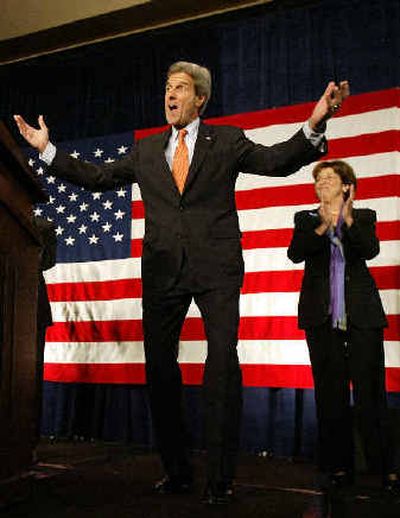 Sen. John Kerry, D-Mass., greets the crowd before speaking at a reception Wednesday in San Francisco. At right is Aida Alvarez, former administrator of the Small Business Administration.
(Associated Press / The Spokesman-Review)