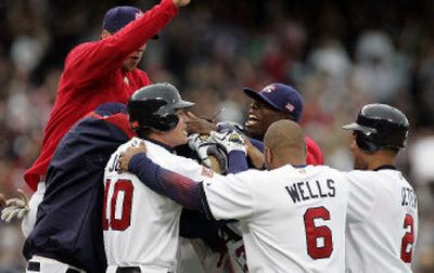 
Team USA's mobs Alex Rodriguez after he got the game-winning base hit in the bottom of ninth inning against Japan. 
 (Associated Press / The Spokesman-Review)