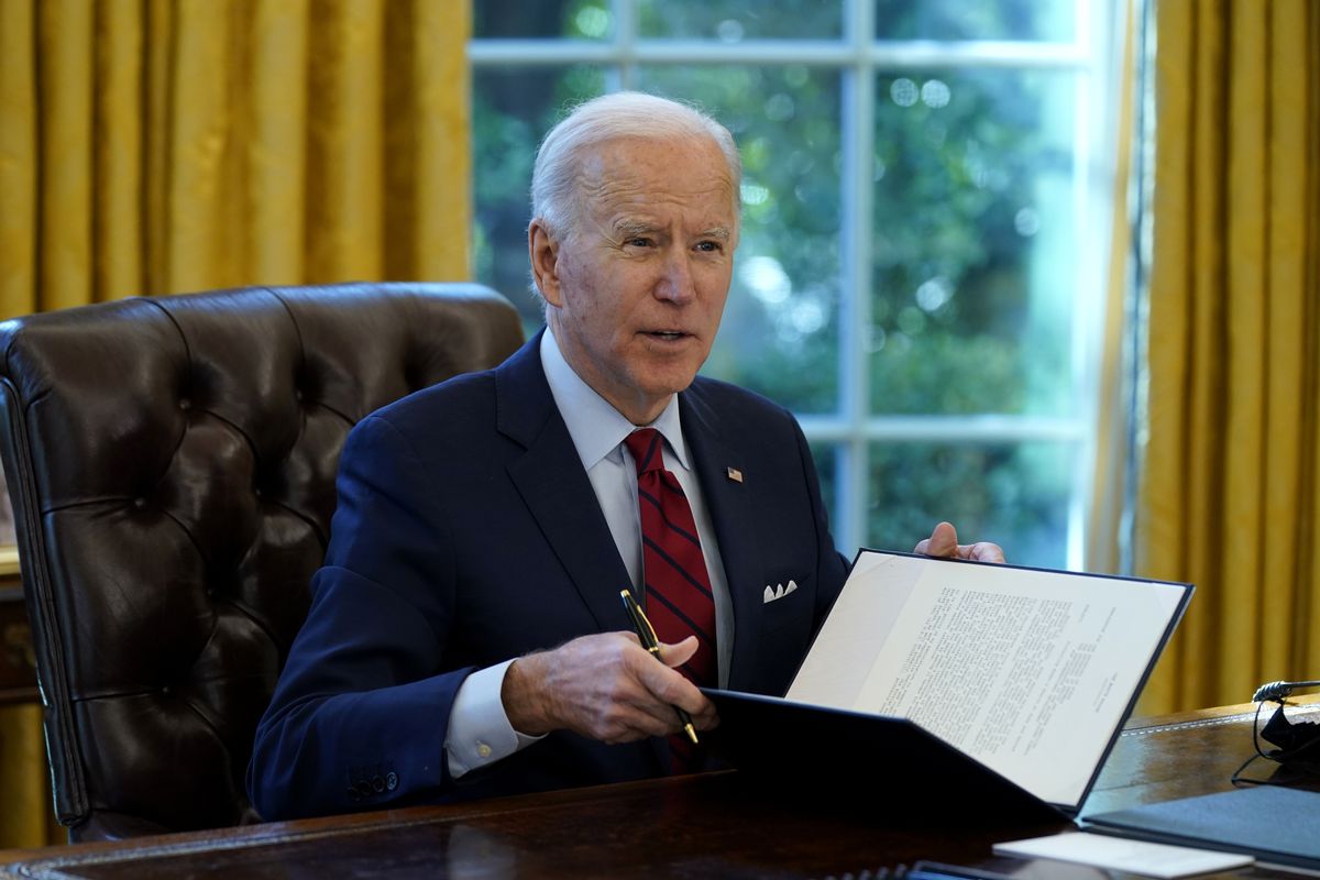 President Joe Biden signs a series of executive orders on health care Thursday in the Oval Office of the White House in Washington.  (Evan Vucci)