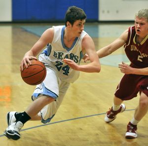 Central Valley’s Tyler Chamberlain (24) blasts past University’s Justin Donahue during a game Jan. 11. (Dan Pelle)