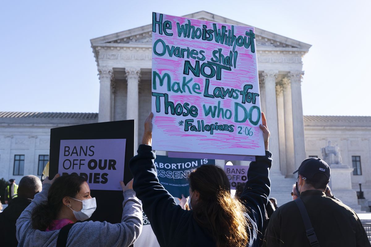 Ava Stevenson, 20, left, of Montgomery County, Md., rallies for abortion rights with her mother Jenni Coopersmith, center, outside the Supreme Court, Monday, Nov. 1, 2021, as arguments are set to begin about abortion by the court, on Capitol Hill in Washington.  (Jacquelyn Martin)