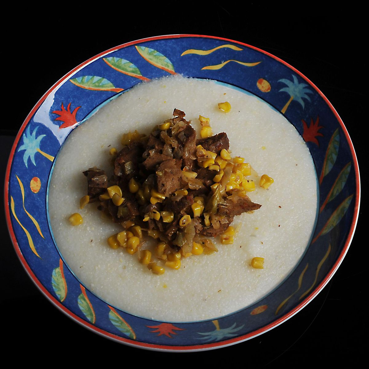 Grits with sausage and sweet corn. (Nate Guidry / Pittsburgh Post-Gazette)