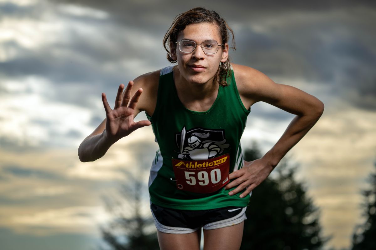 Véronica Garcia, a transgender track athlete from East Valley High School, displays five fingers representing the five races in which she had competed for her high school by last October.  (COLIN MULVANY/THE SPOKESMAN-REVIEW)