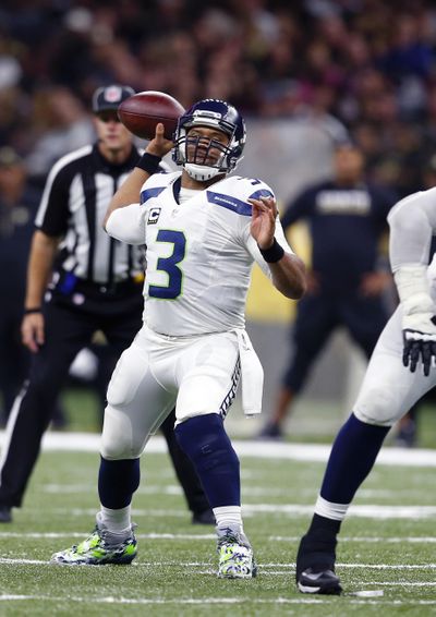 Seattle Seahawks quarterback Russell Wilson said he puts his ultimate trust in his receivers. (Butch Dill / Associated Press)