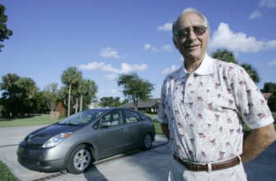 
Robert A. Marks stands in front of his Toyota Prius Hybrid  in Parkland, Fla. Parkland offers free parking  for hybrid car owners. Associated Press
 (Associated Press / The Spokesman-Review)