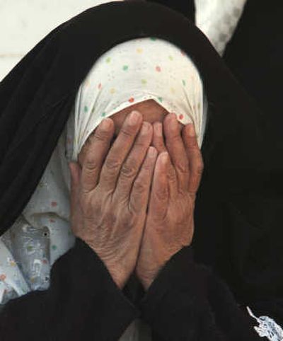 
The widow of Riyadh al-Samarrai grieves at Abu Hanifa mosque in the Azamiyah district of Baghdad  on Monday. Associated Press
 (Associated Press / The Spokesman-Review)