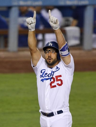 Los Angeles Dodgers' Rob Segedin celebrates after hitting a solo home run during the second inning of a baseball game against the San Francisco Giants. (Mark J. Terrill / Associated Press)